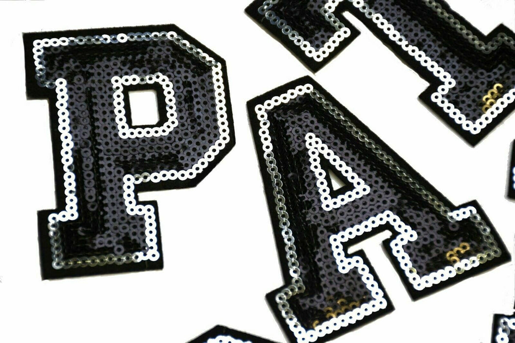 Black and silver sequin iron on patch letters 7.5cm height close-up of letters PAT