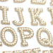 White pearl gold rhinestone iron-on patch letters used for brides and personalising clothing.